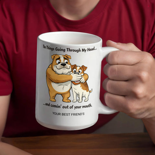 Person holding a personalized  mug with cartoon bulldogs and humorous text, wearing a red shirt.